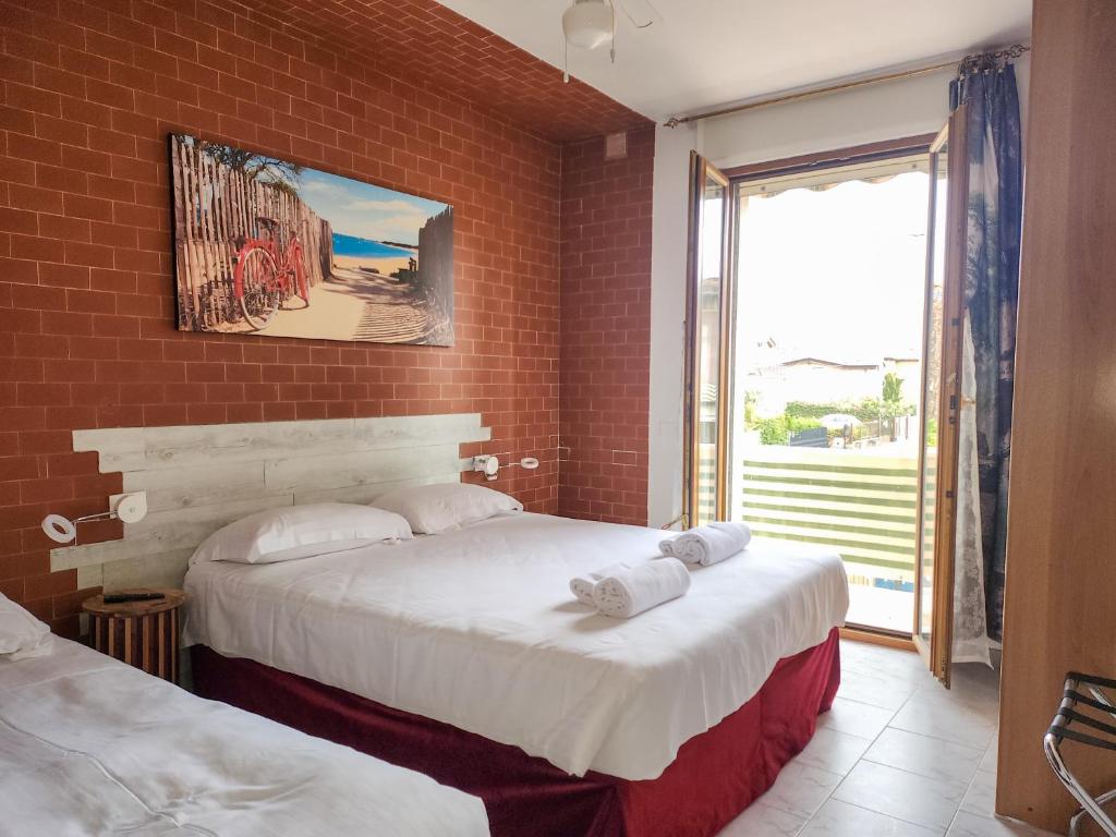 En eller flere senge i et værelse på Bike house Stelvio