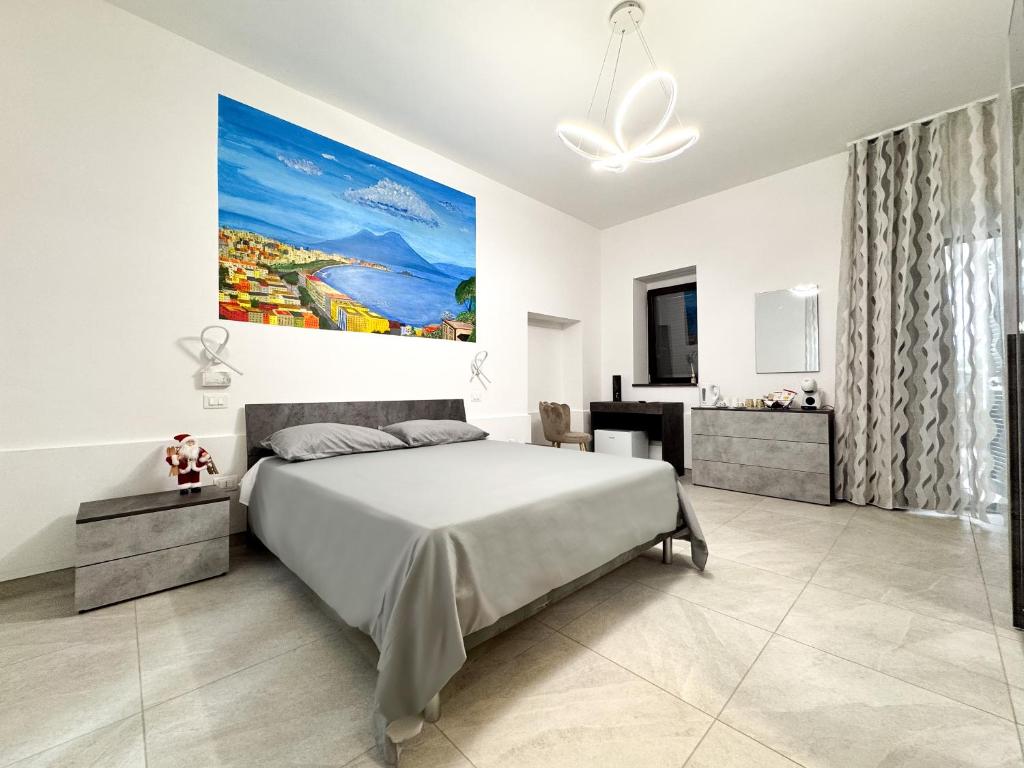 En eller flere senge i et værelse på Pompei Comfort Room