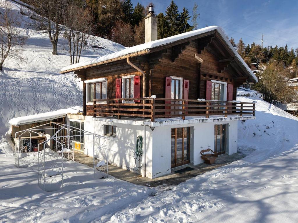 a house covered in snow in the snow at Chalet Fauvette in La Tzoumaz