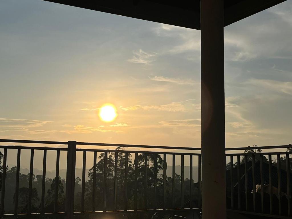 a view of the sunset from a balcony at Mountain View in Bandarawela