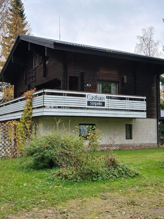 a building with a sign on the side of it at Gasthause in Rautjärvi