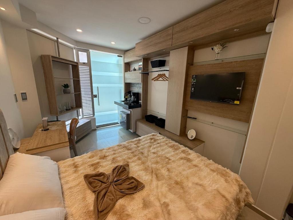 a bedroom with a table with a bow on it at Tiny Spot in Ocaña