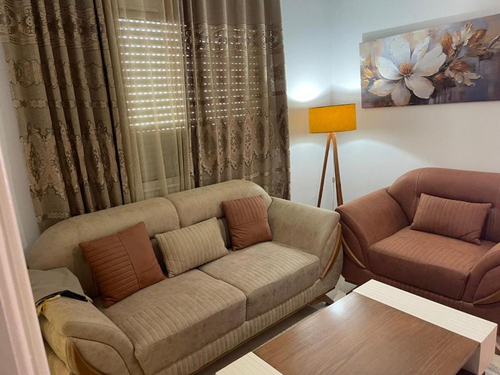 a living room with a couch and a table at حي النصر 2 in Ariana