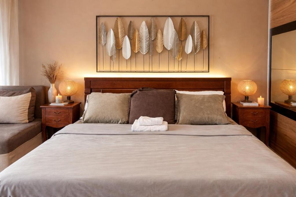 a bedroom with a bed with a white towel on it at Podgorica City Center Apartment Main Boulevard View Free Wi-Fi in Podgorica