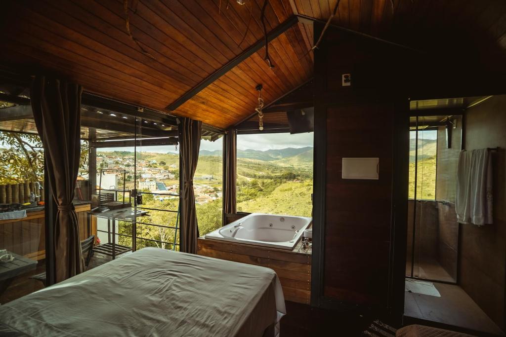 Postel nebo postele na pokoji v ubytování Deck's Chalés Serra da Canastra