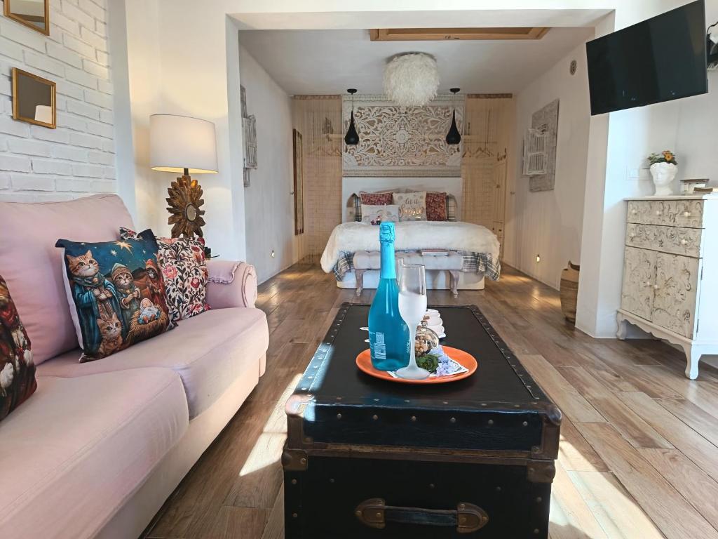a living room with a couch and a table at Estudio Jazmín in Nerja