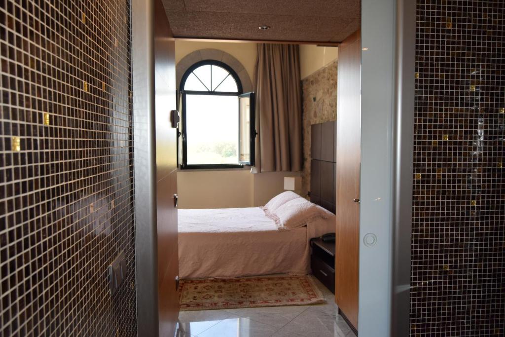 Postel nebo postele na pokoji v ubytování Hotel Històric