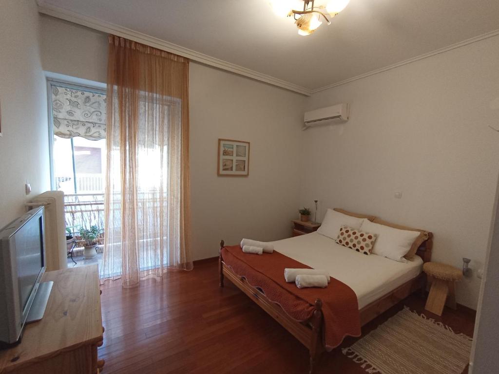 En eller flere senge i et værelse på Nataliya's Nafplio apartment