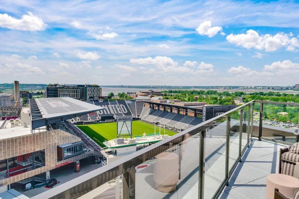 an apartment balcony with a view of a baseball stadium at The View - Navy Yard Washington DC in Washington, D.C.