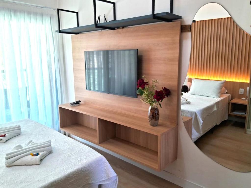 En eller flere senge i et værelse på Araça flat 308 - Lateral Vista Jardim