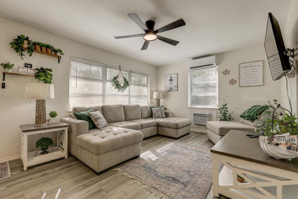 a living room with a couch and a ceiling fan at Walk to Shops and Dining Downtown Stuart Home! in Stuart