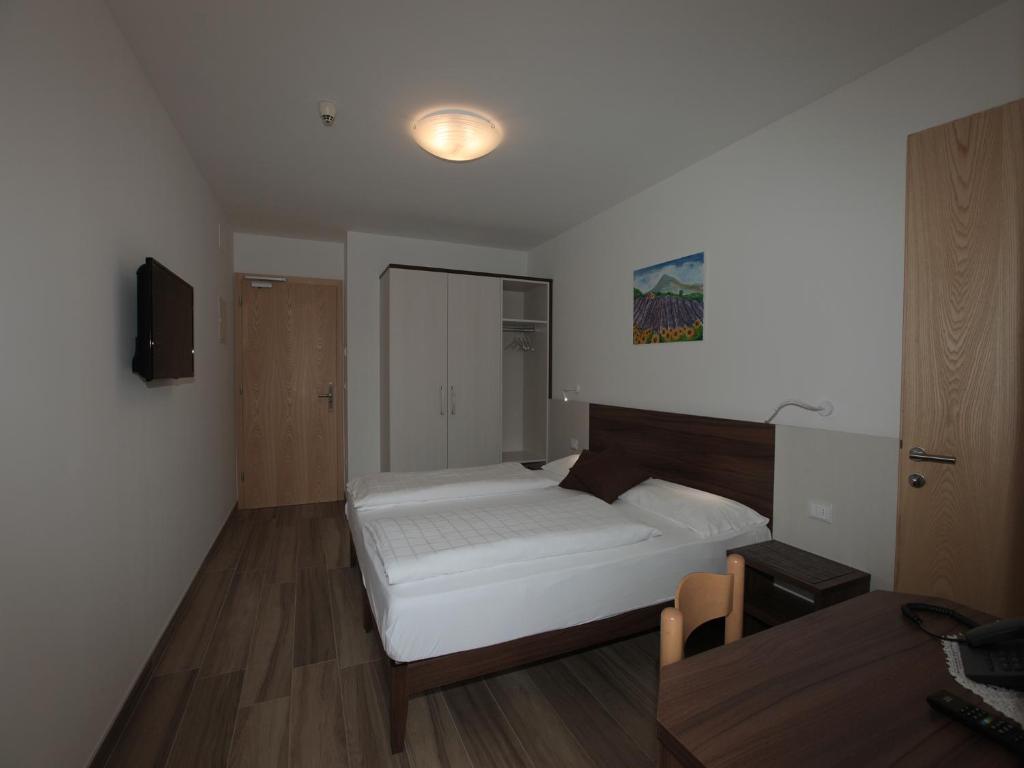 Postel nebo postele na pokoji v ubytování Hotel Stampfer B&B