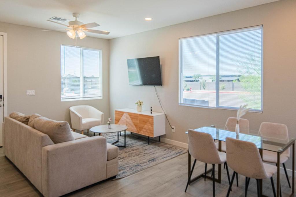 a living room with a couch and a table at Serene 2BR Home with Premium Beds in Glendale
