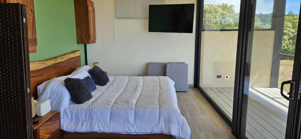 En eller flere senge i et værelse på Casas Oria Monteverde