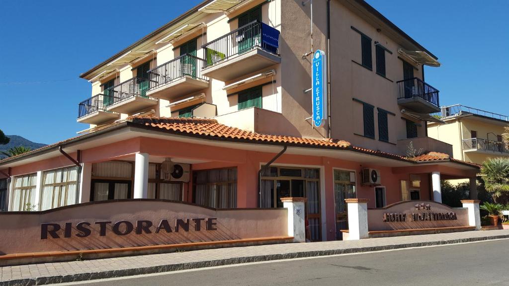 a building with a sign for a r destinationerate at Hotel Villa Etrusca in Marina di Campo