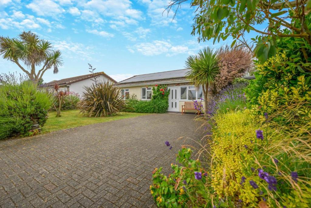 a house with a garden and a driveway at 3 Bed in St. Merryn oc-p00114 in Saint Merryn