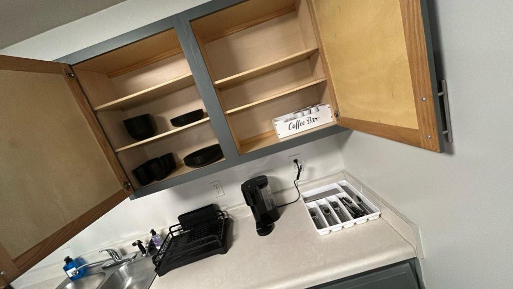 a kitchen with a sink and a counter top at Modern Space Great For Extended Stays Pool & Gym in Burnside East