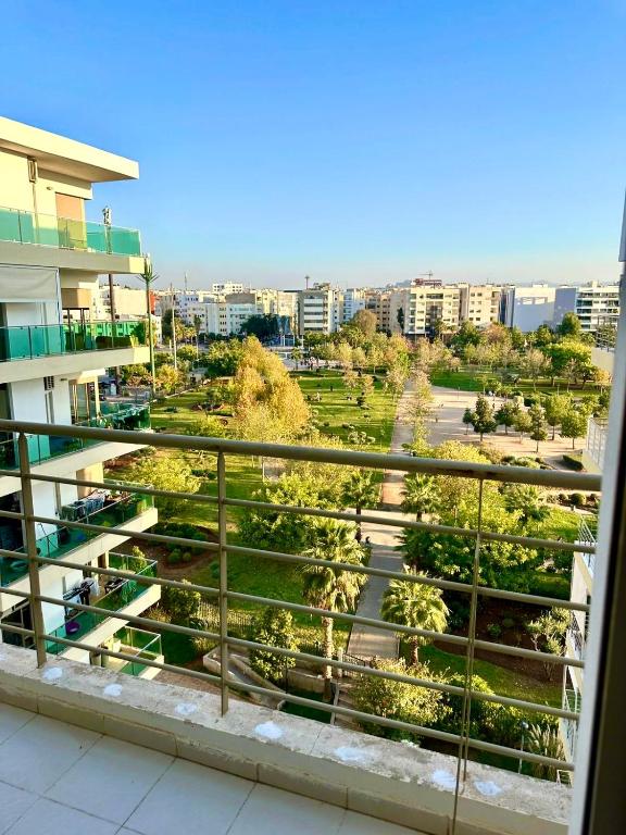 a view of a park from a balcony of a building at Appartement avec vue sur parc et Wifi 100 Mo illimité ! in Fez