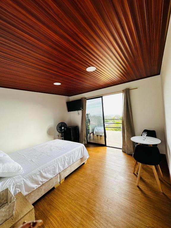 En eller flere senge i et værelse på Cabaña americana