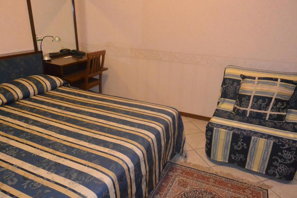 Postel nebo postele na pokoji v ubytování Hotel Italia City Center
