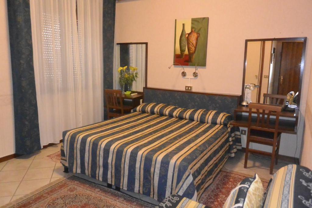 Postel nebo postele na pokoji v ubytování Hotel Italia City Center