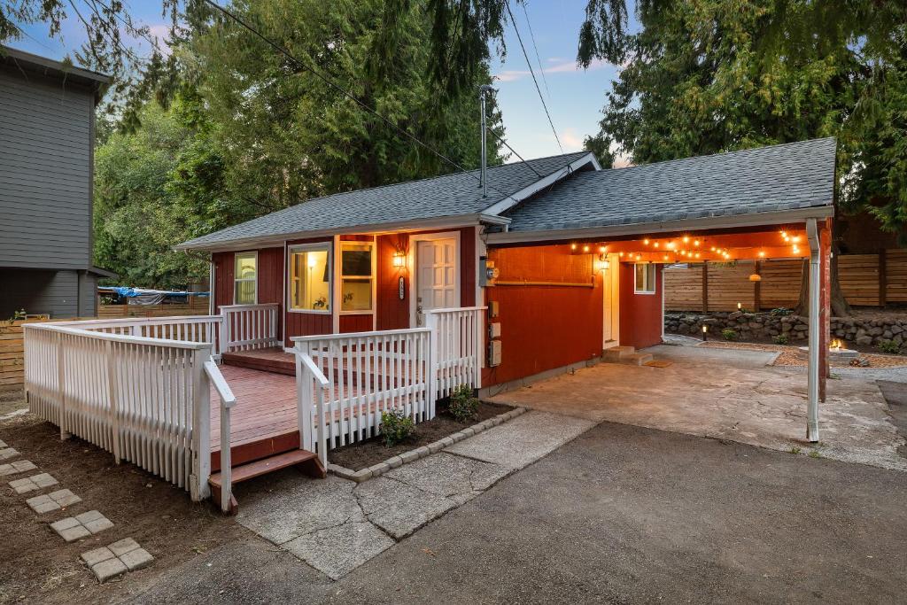 a small house with a porch with lights on it at Seattle cottage in Seattle