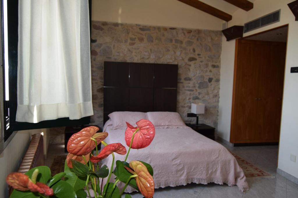 Postel nebo postele na pokoji v ubytování Hotel Històric