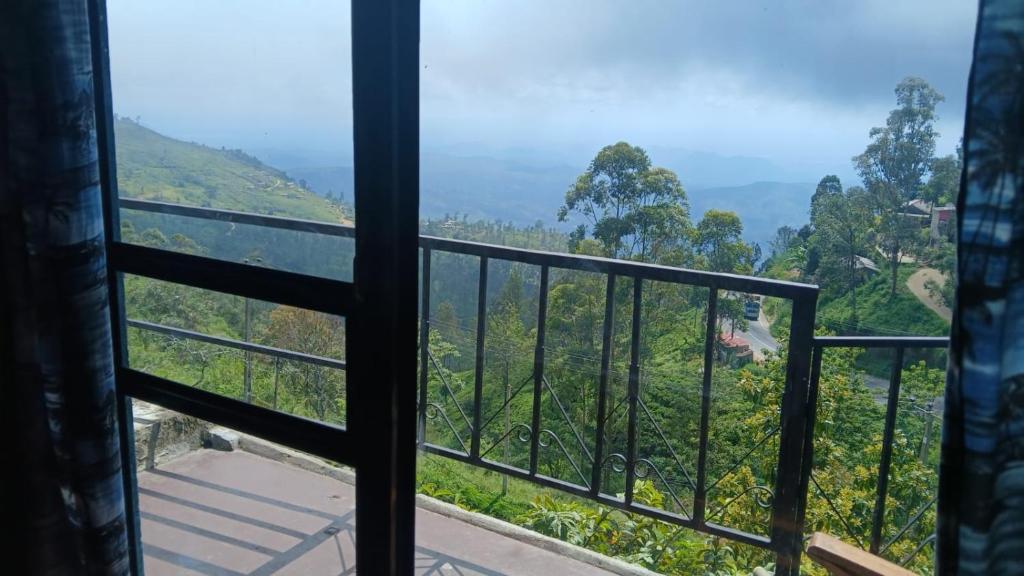 a view from a window of a mountain view at Thumb Up Family Rest in Haputale