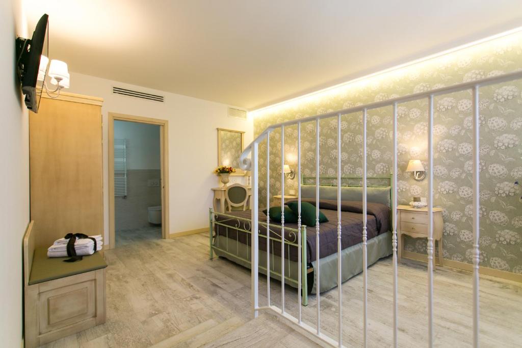 Postel nebo postele na pokoji v ubytování Guest House Dolce Laguna