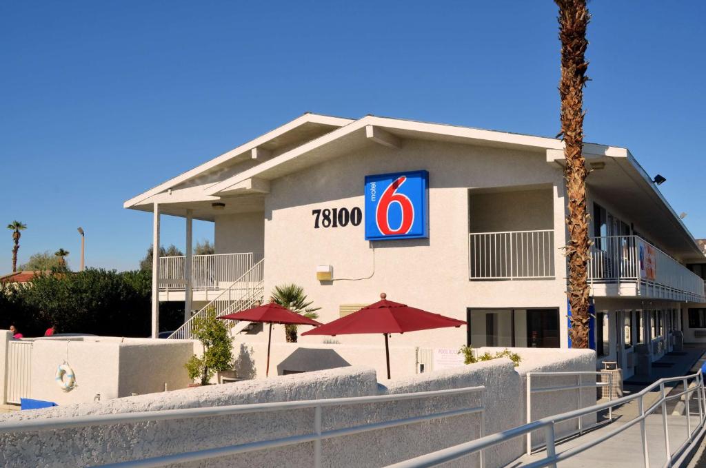 a hotel with a sign on the side of it at Motel 6-Palm Desert, CA - Palm Springs Area in Bermuda Dunes