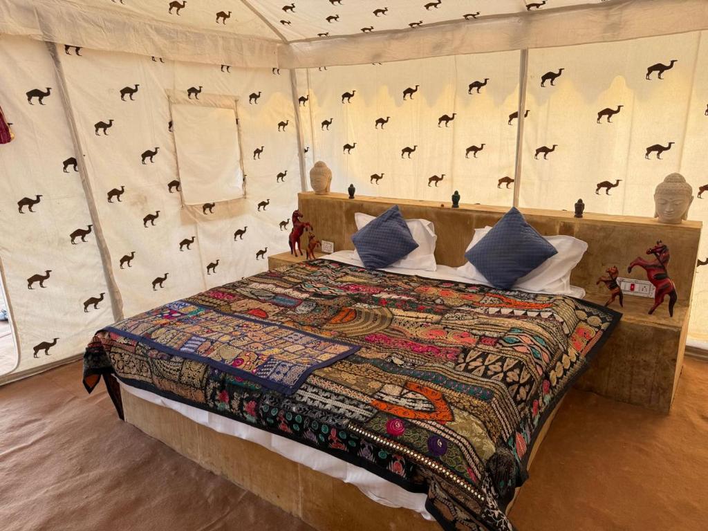 a bedroom with a bed in a tent with horse wall at Style Heritage Resort & Camp in Sām