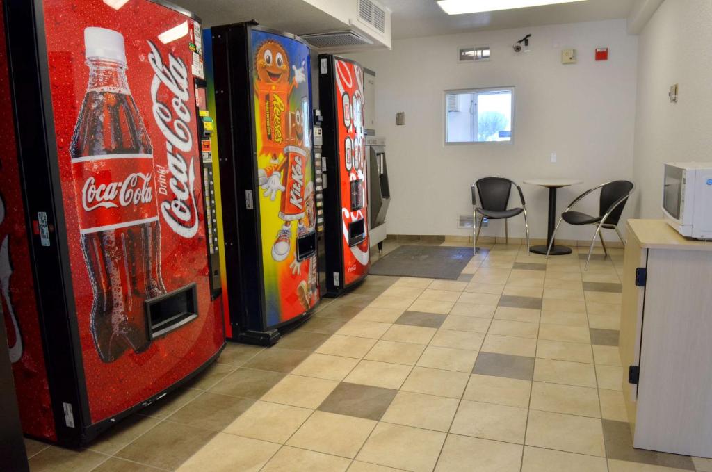 a row of cocacola soda machines in a room at Motel 6-Santa Nella, CA - Los Banos - Interstate 5 in Santa Nella