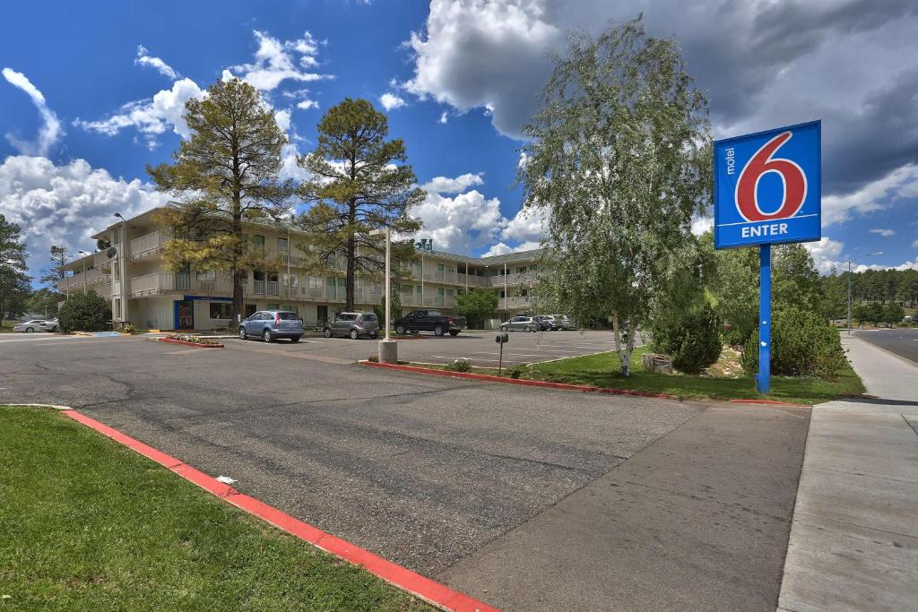 a sign for a gas station on a street at Motel 6-Flagstaff, AZ - West - Woodland Village in Flagstaff