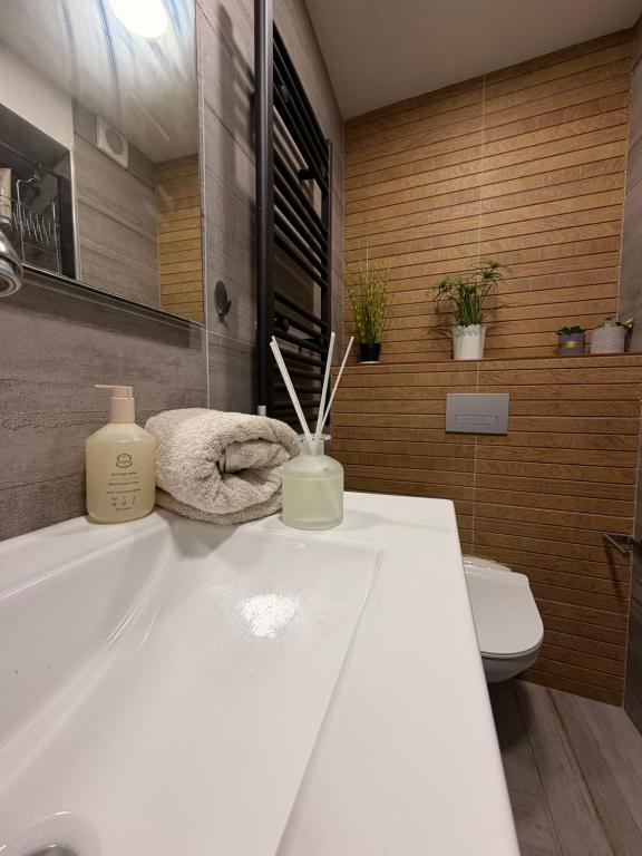 a bathroom with a white sink and a toilet at The Caesar Stay in Caesarea