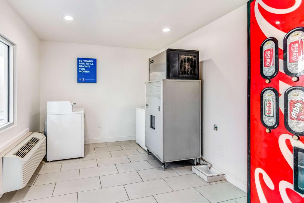 a kitchen with two refrigerators in a room at Motel 6-Visalia, CA in Visalia