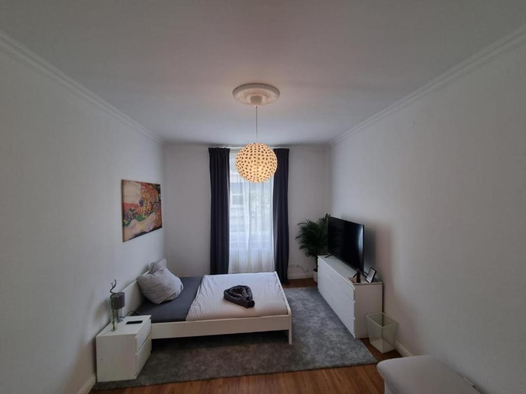 a living room with a bed and a television at Süße Marie 2 in Karlsruhe