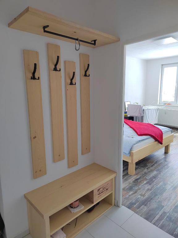 a room with a bedroom with a bed and a closet at Apartmán Emma Volary in Volary