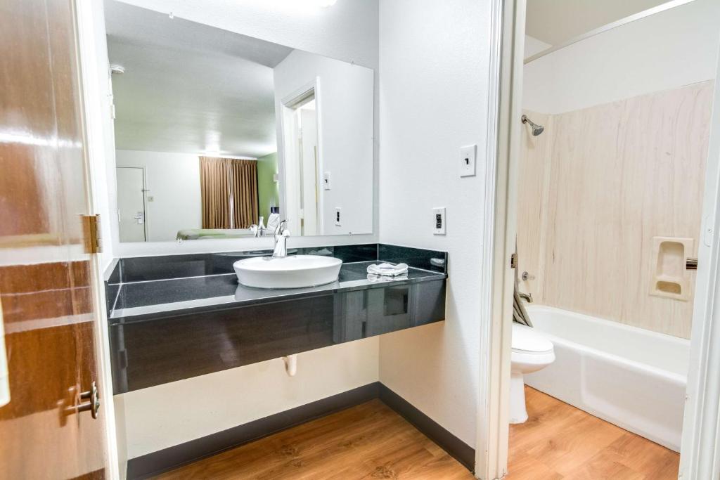 a bathroom with a sink and a toilet at Motel 6-Longview, TX - North in Longview