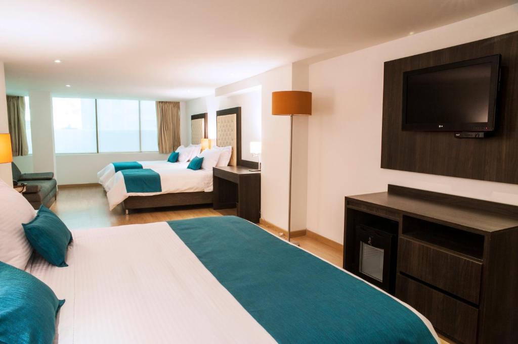 Postel nebo postele na pokoji v ubytování Hotel Grand Park