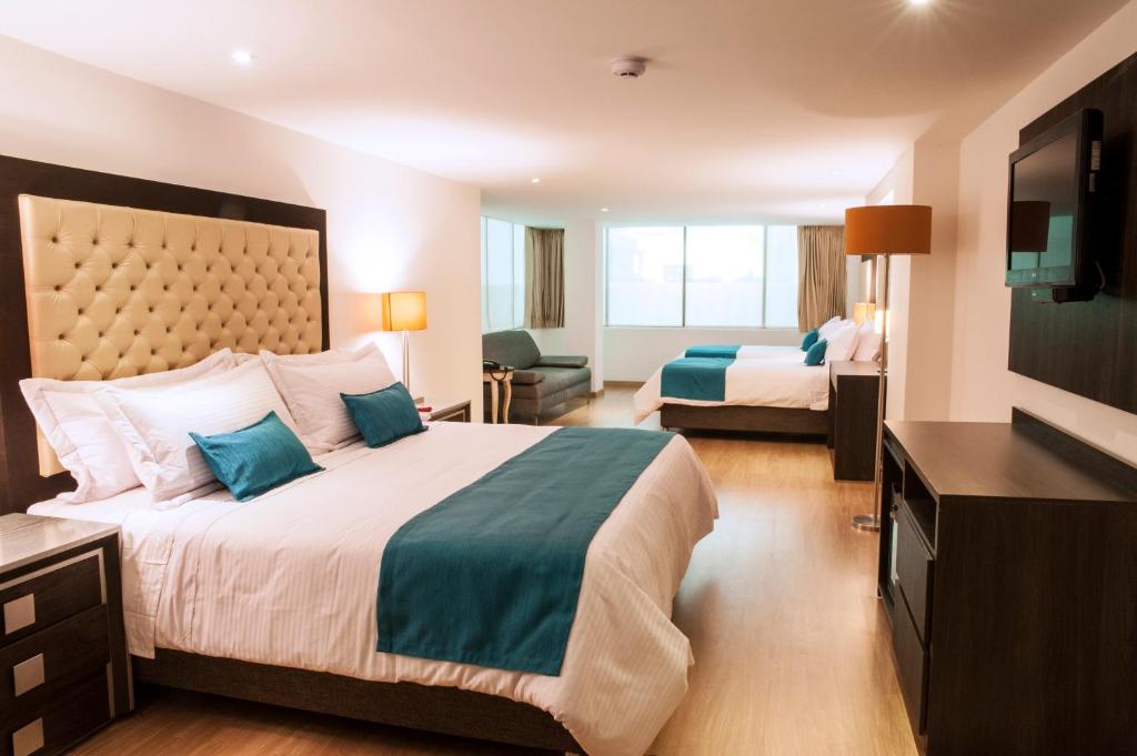 Postel nebo postele na pokoji v ubytování Hotel Grand Park
