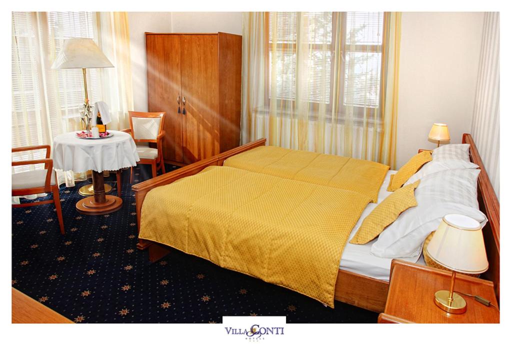Postel nebo postele na pokoji v ubytování Hotel Villa Conti