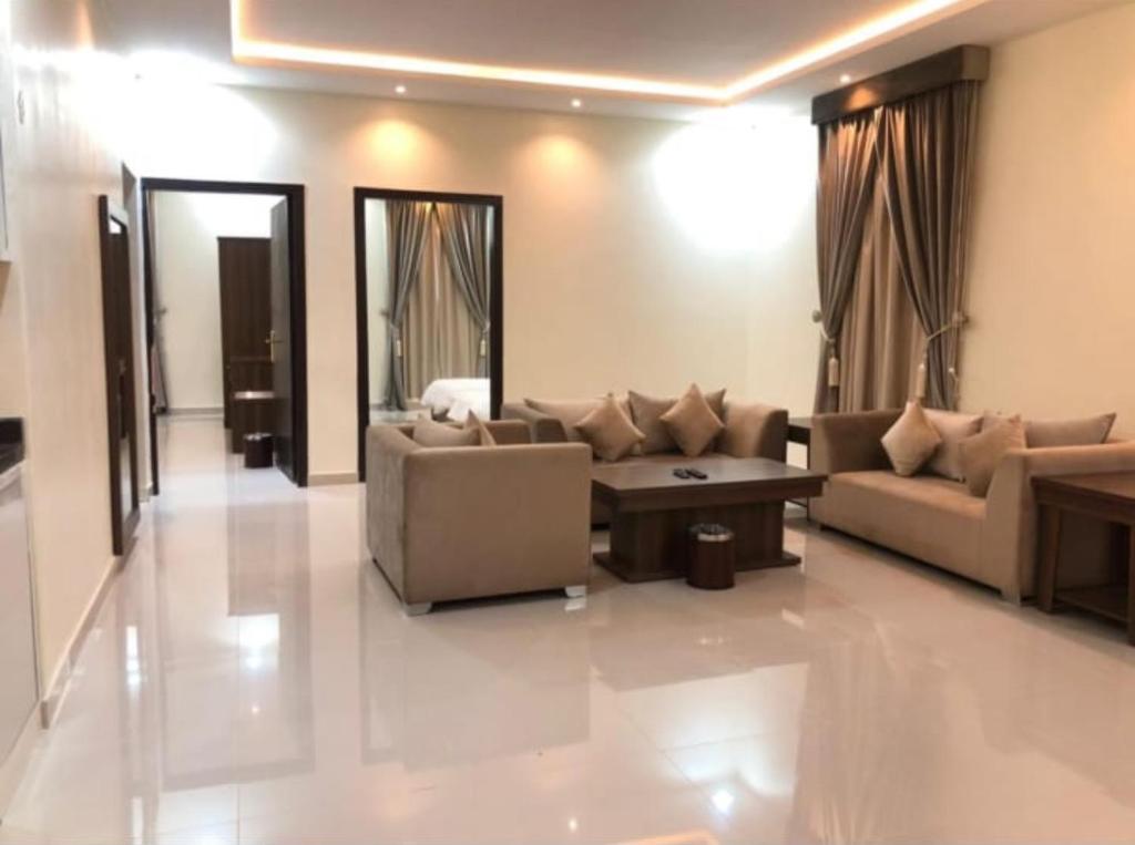 Posezení v ubytování الذيابي للشقق المخدومة