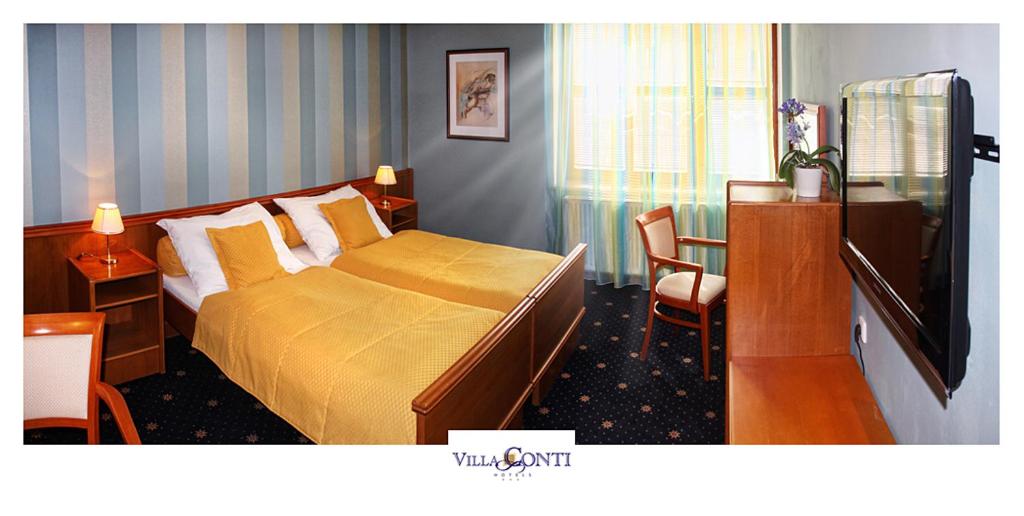 Postel nebo postele na pokoji v ubytování Hotel Villa Conti