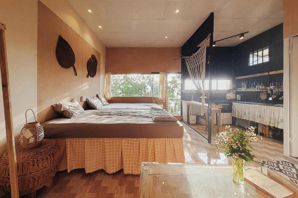 a bedroom with a large bed in a room at Samstay Đà Lạt in Ấp Ða Lợi