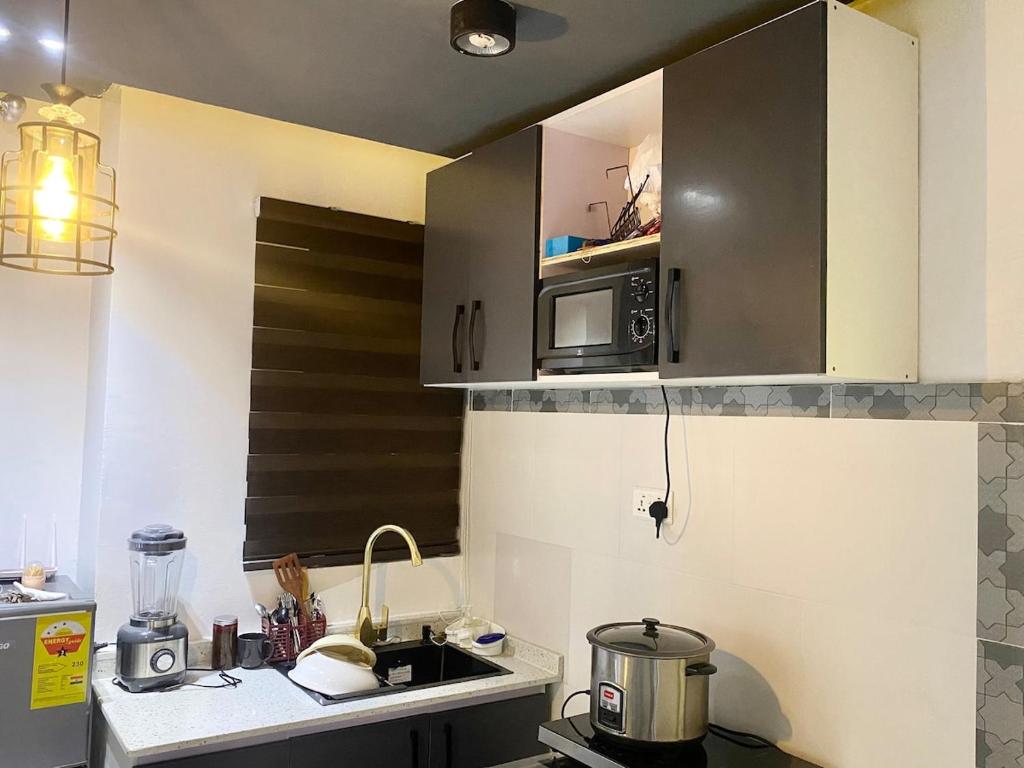 Køkken eller tekøkken på Apartment in Accra