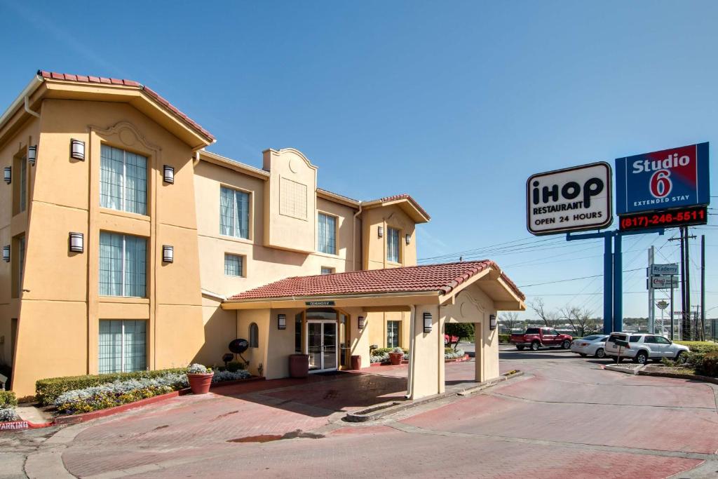 a hotel with a sign in front of a building at Studio 6-Fort Worth, TX - West Medical Center in White Settlement