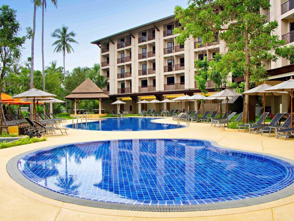 a large swimming pool in front of a hotel at ibis Styles Krabi Ao Nang in Ao Nang Beach