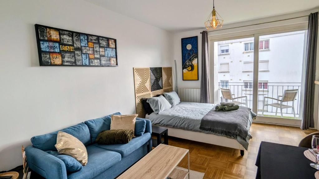 En eller flere senge i et værelse på Appartement de charme