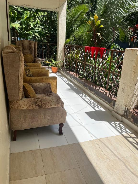a group of chairs sitting on a porch at Lifeline Homes in Kiserian