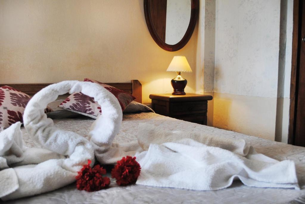 Una cama o camas en una habitación de Hotel Ibiza